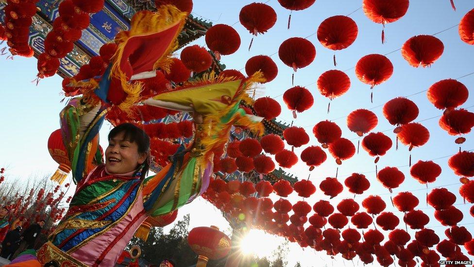 A Chinese folk artist performs during the opening ceremony of the Spring Festival Temple Fair at the Temple of Earth park on 30 January in Beijing