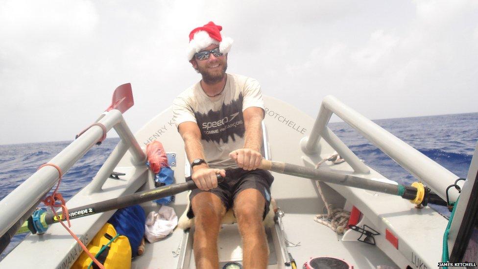 James Ketchell rowing wearing a santa hat