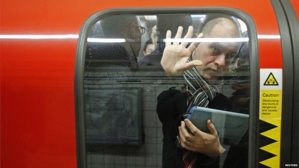 A passenger squeezed into a tube at Oxford Circus