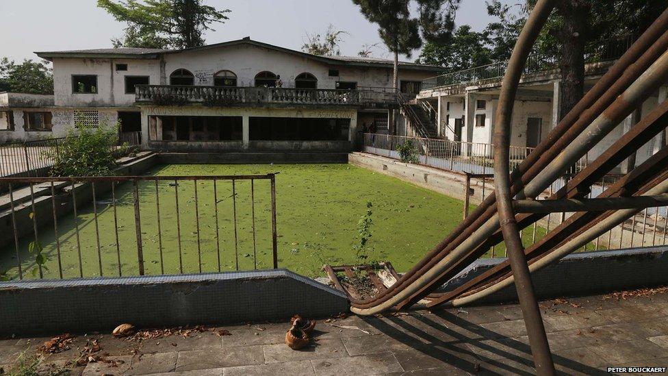 The green swimming pool and old slide at Bokassa's former palace - Central African Republic, February 2014