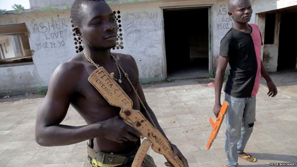 Army recruits with wooden weapons at Bokassa's old palace - Central African Republic, February 2014