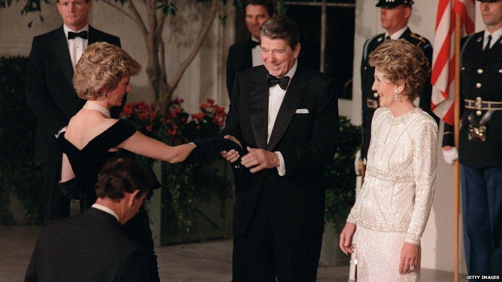 President Ronald Reagan shakes hands with Princess Diana as she and Prince Charles enter the White House for a state dinner on 9 November 1985