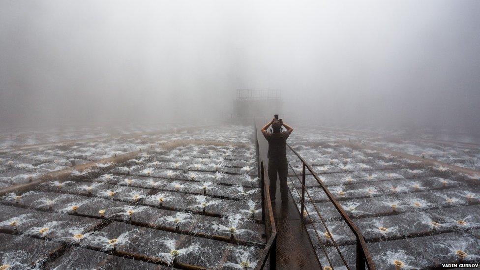 Man in a misty industrial site
