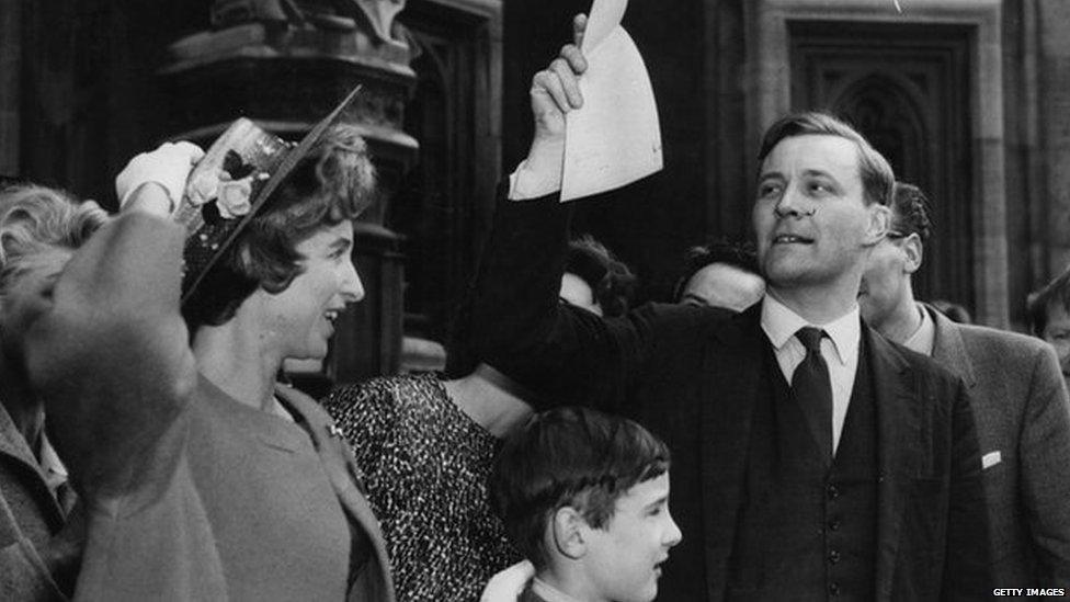 May 4th 1961: Anthony Wedgwood Benn leaving the House of Commons with his wife Caroline, after being re-elected to Bristol South East