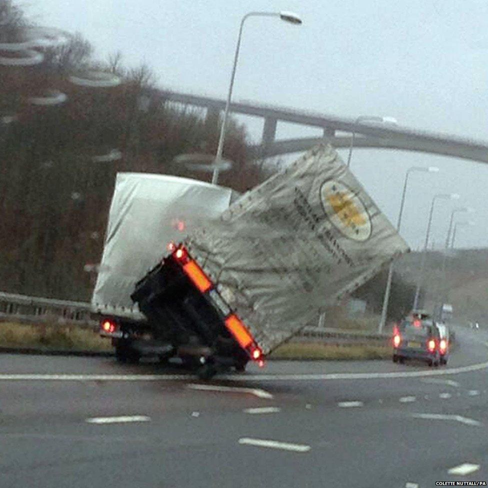 A lorry overturns on the M62 motorway at Scammoden water in West Yorkshire