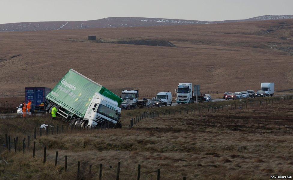 A truck is seen after being blown off the road on the A628, Woodhead Pass, near Preston between Manchester and Sheffield