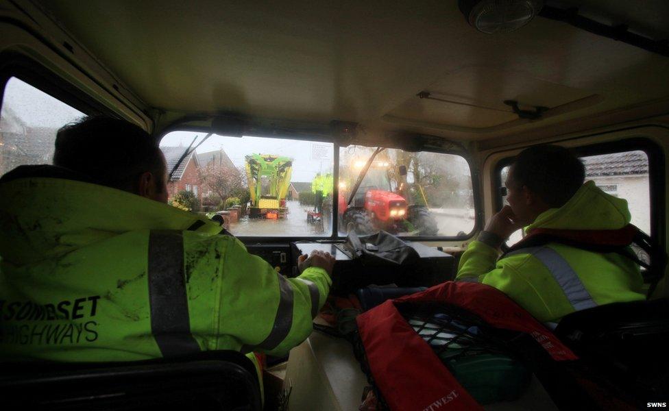 View from the cab of an all terrain vehicle being used to get around flooded Moorland