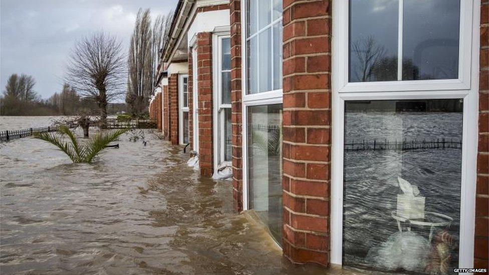 A row of terrace houses along the banks of the river were flooded on Wednesday.