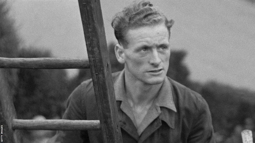 Sir Tom Finney up a ladder