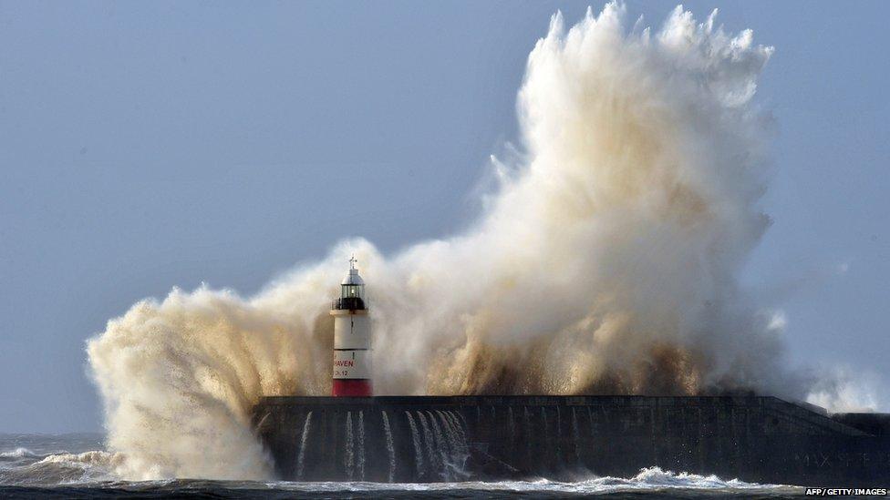 Waves hit Newhaven lighthouse