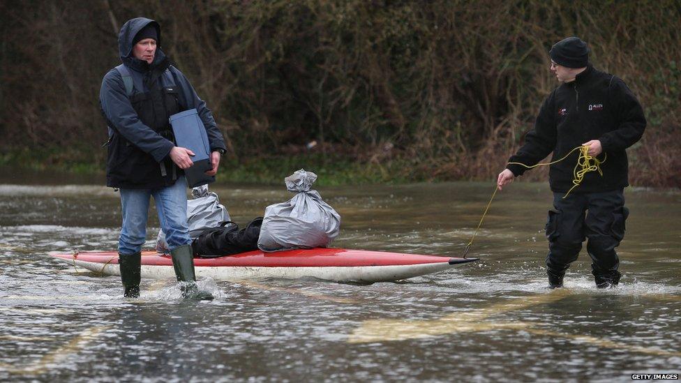 People use canoes to transport their belongings