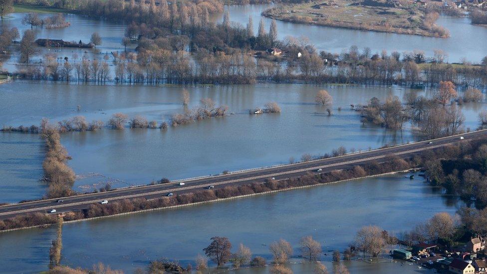 Flood water surrounds the M3 motorway near to Chertsey