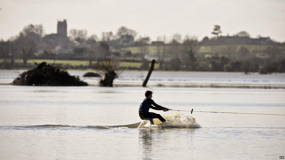 A wakeboarder rides the flood water on the Somerset Levels