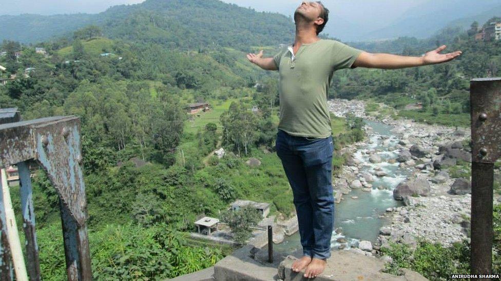 Anirudha Sharma with arms out in Himachal Pradesh in northern India