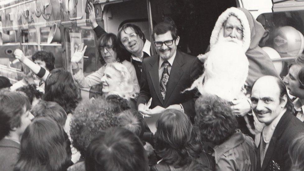 Presenters being mobbed while collecting Christmas presents for Birmingham children