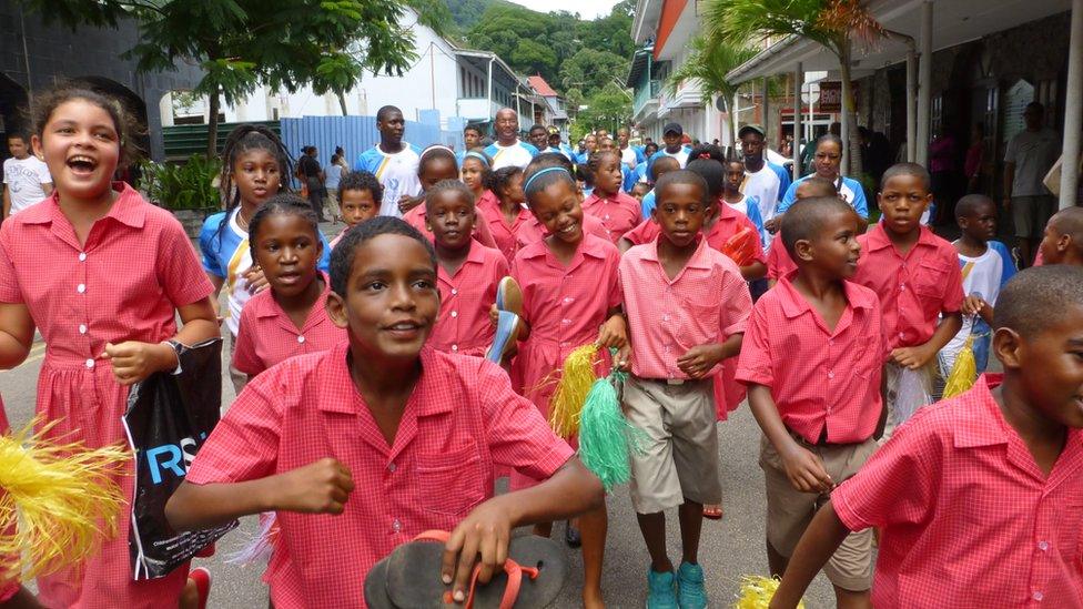 Children running excitedly down the streets during the celebrations in Mauritius.