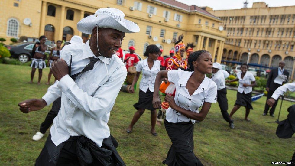 Dancers from Lusaka Secondary School Cultural Group perform in honour of the Queen's baton at the Cabinet Office in Lusaka, Zambia