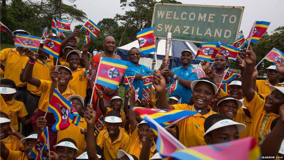 The Queen's Baton arrives at Lomahasha border crossing point, Swaziland - the first time the baton reached a new country on foot.