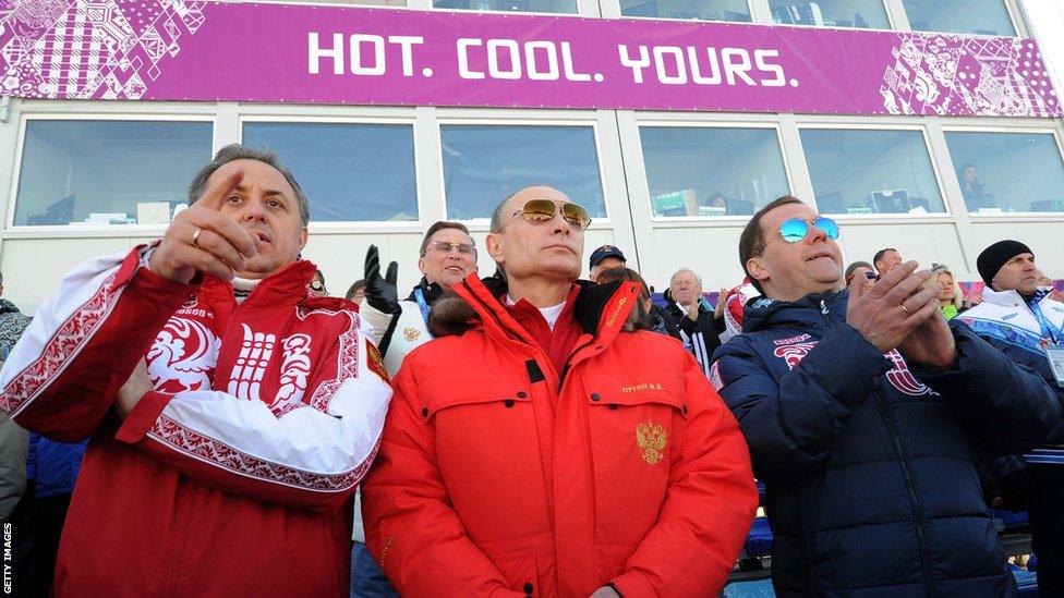 Russia's President Vladimir Putin , Prime Minister Dmitry Medvedev and Sports Minister Vitaly Mutko (L) watch the men's cross-country 4 x 10 km relay event at the 2014 Sochi Winter Olympics on February 16, 2014.