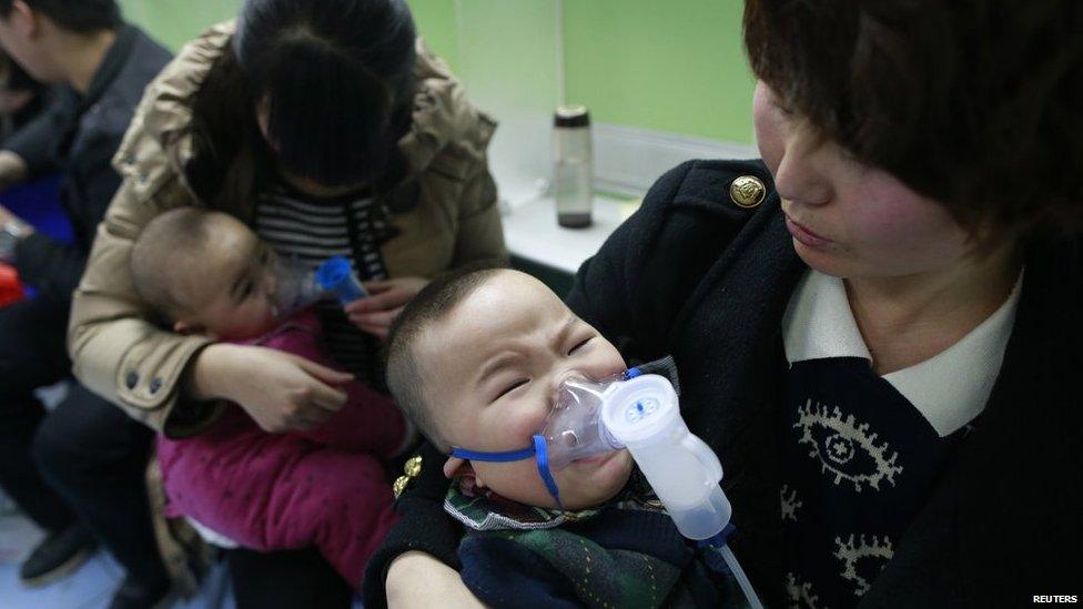 Children with respiratory illness receive treatment at a hospital in Beijing on 21 February 2014