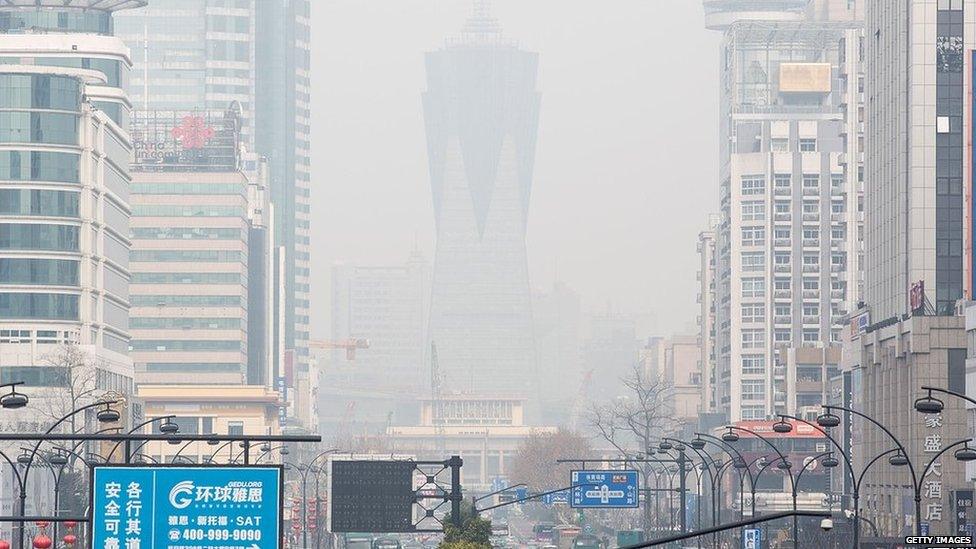 A smog hangs over the business area on 23 February 2014 in Hangzhou, China