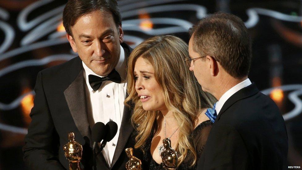 Peter Del Vecho, Jennifer Lee and Chris Buck accept the Oscar for best animated feature film for Frozen at the 86th Academy Awards in Hollywood