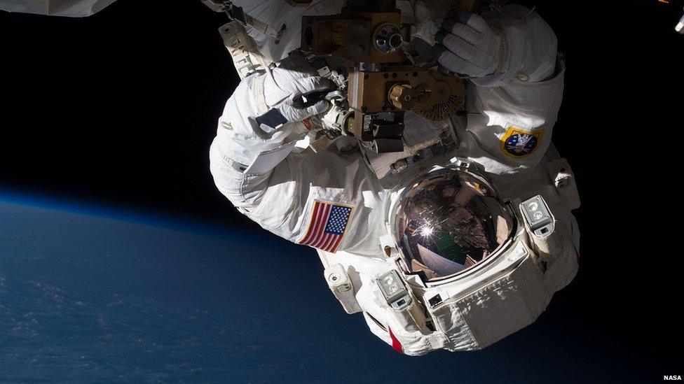 Flight Engineer Chris Cassidy repairing the station in orbit on Expedition 35.