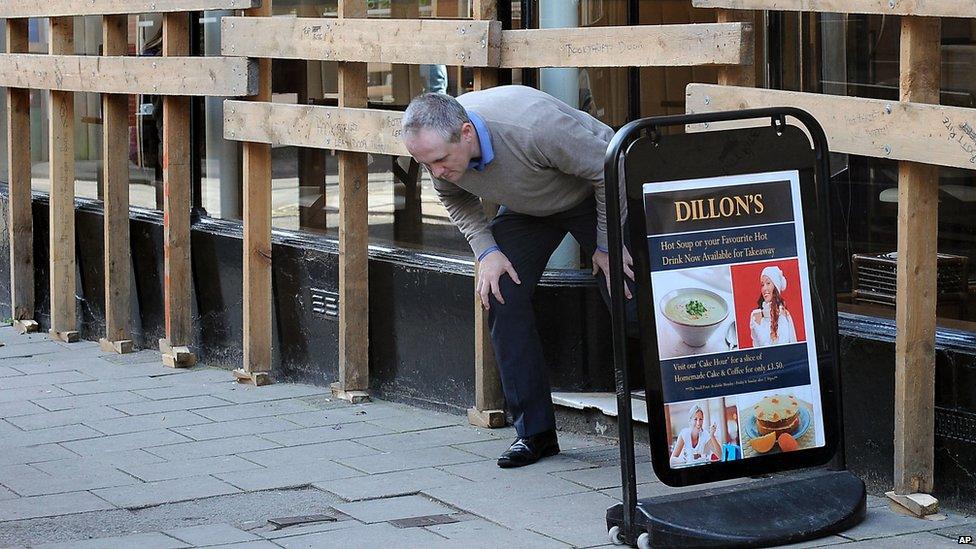 Customer leaving a shop in Ashbourne