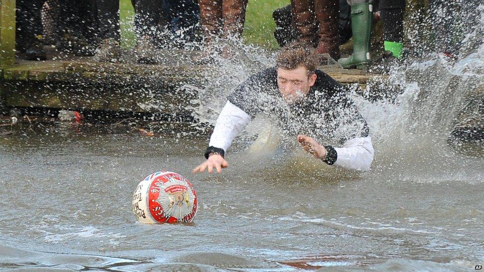 Player swims to grab the ball