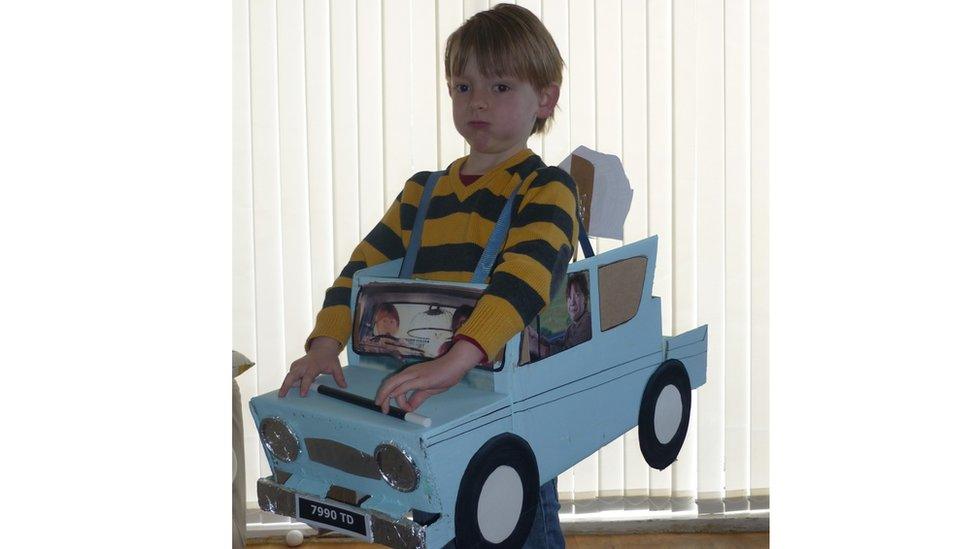 Milo with a cardboard car