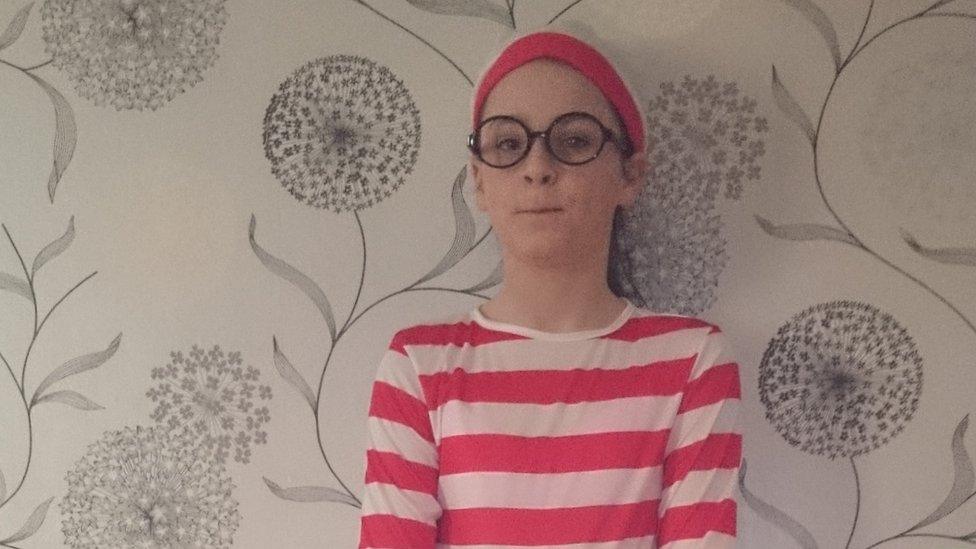 Ella dressed in red and white striped costume