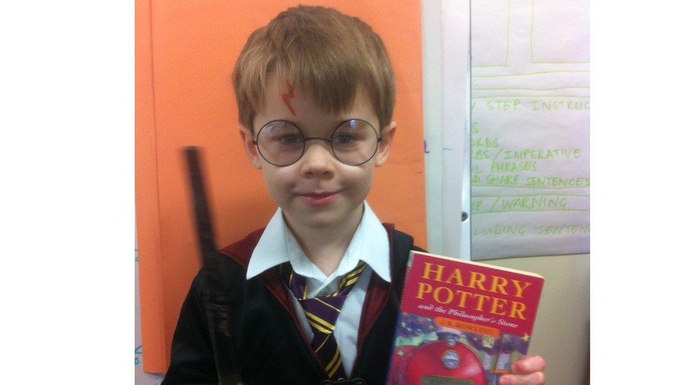 Felix with a wand and a lightning scar