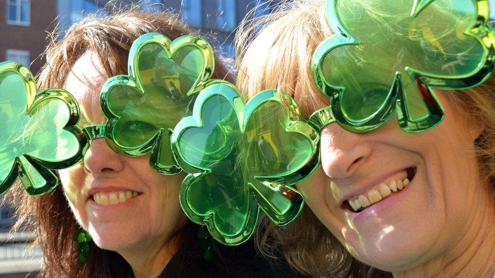 Ladies wearing Shamrock glasses