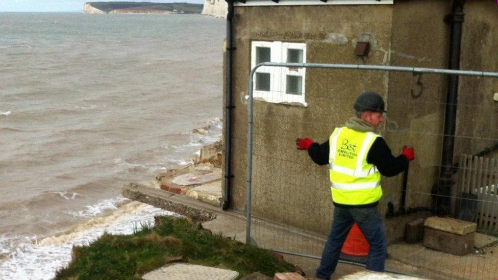 Demolition of a cottage at Birling Gap