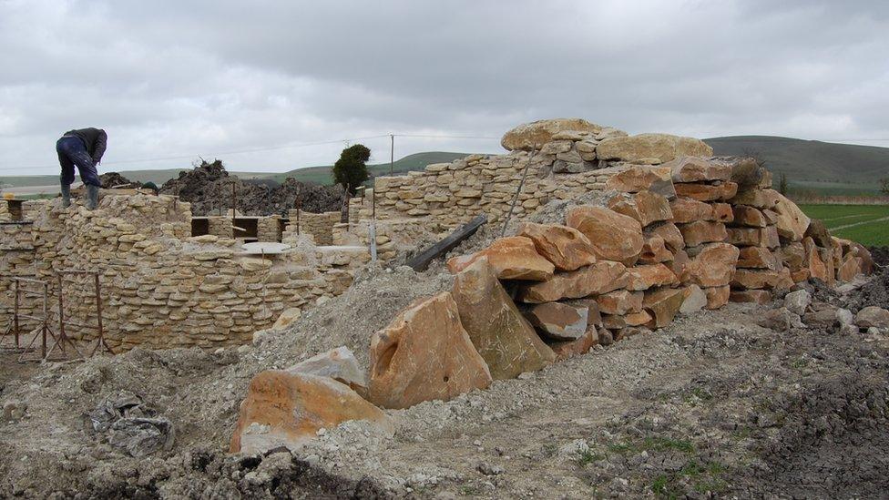 Stonemason working on All Cannings long barrow