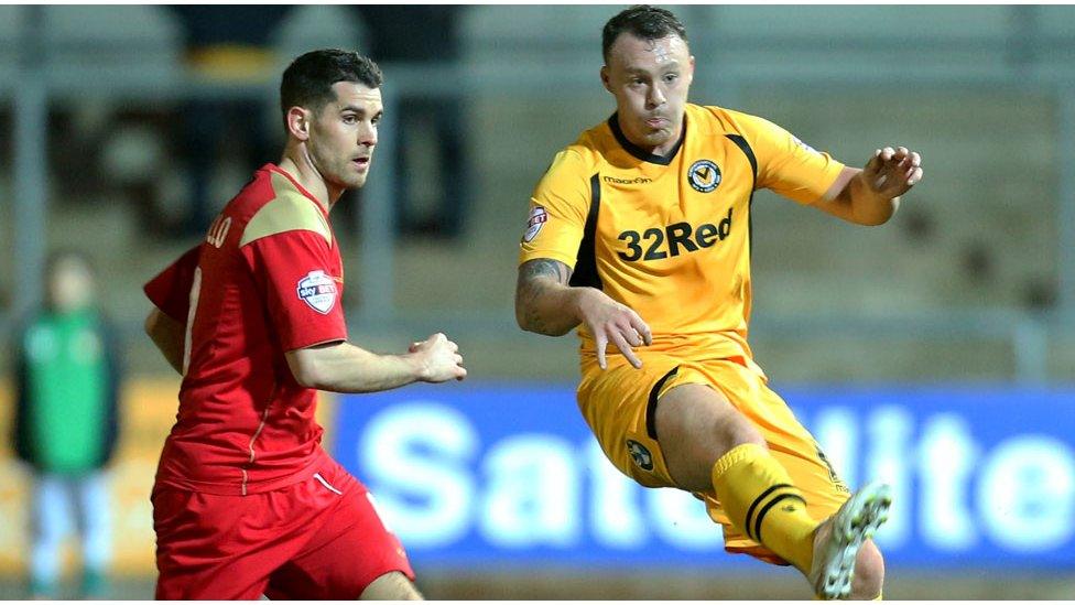 Newport County's Darcy Blake passes the ball against Bury