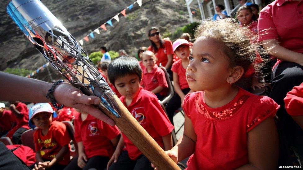 A Pilling Primary School student holds the Queen's baton in Jamestown, St. Helena.