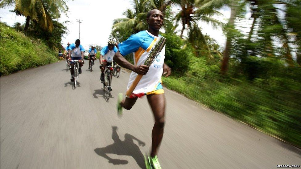 Long distance runner Caswin Prince runs with the baton in Kingstown, St. Vincent and the Grenadines.