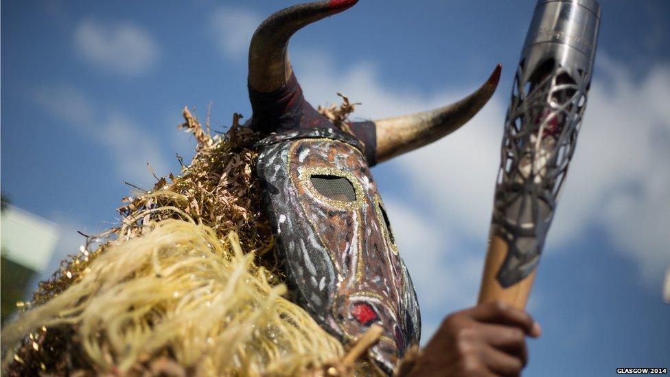 A member of the Vitus Mask Group wearing a Jambill mask during a cultural performance in Antigua.