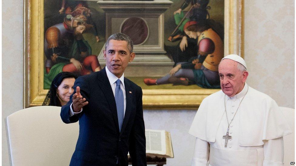 President Barack Obama gestures while alongside Pope Francis at the Vatican