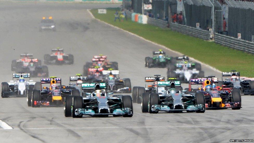 Williams Formula One driver Valtteri Bottas of Finland drives ahead of Red Bull Formula One driver Sebastian Vettel of Germany during the Malaysian F1 Grand Prix.