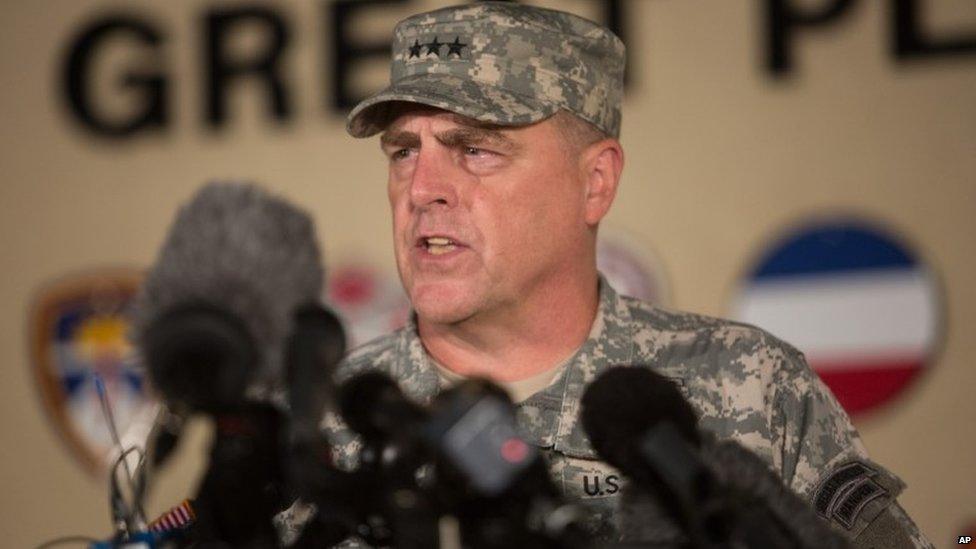 Lt Gen Mark Milley speaks to reporters outside Fort Hood military base following the shooting there on 2 April 2014