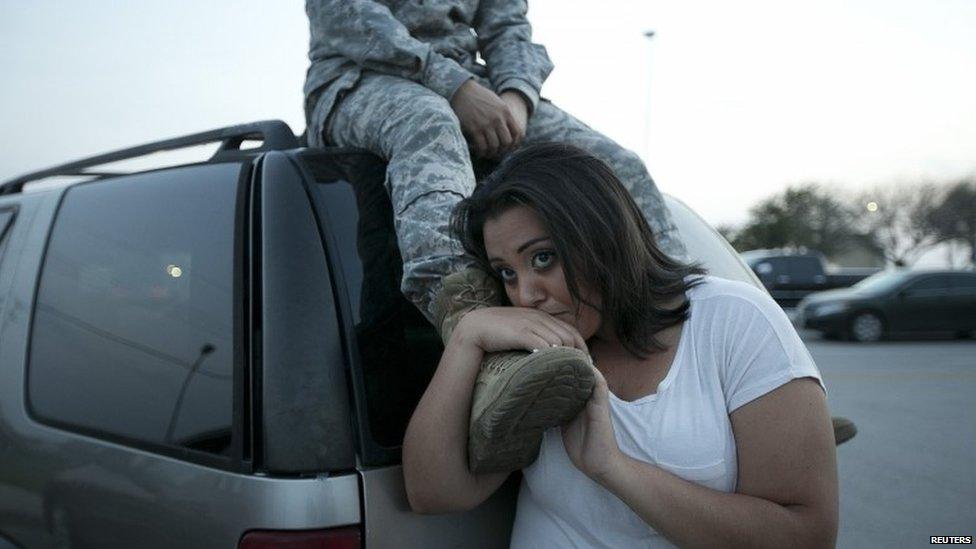 Luci Hamlin and her husband Specialist Timothy Hamlin wait to get back to their home on base at Fort Hood, Texas, 2 April