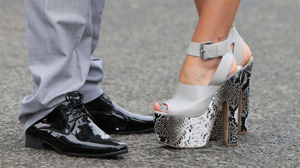 Race goers in fancy shoes on Ladies Day