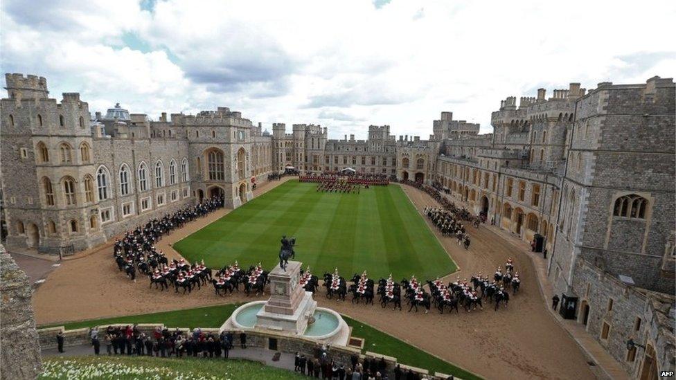 Mounted soldiers parading around the Quadrangle at Windsor Castle