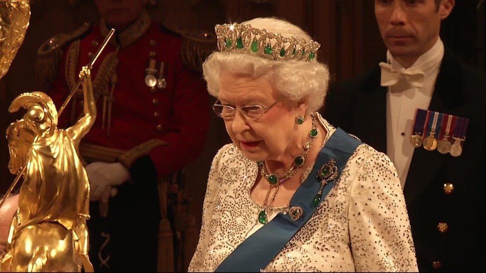 Queen Elizabeth II speaking at a formal banquet.