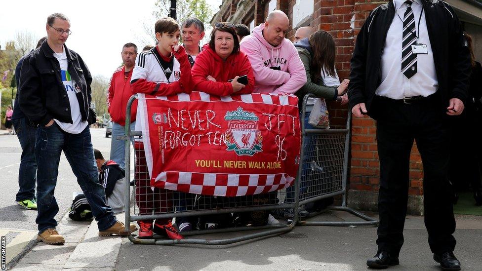 Fans outside Craven Cottage display a banner paying their own tribute ahead of Fulham's match with Norwich City in the Premier League