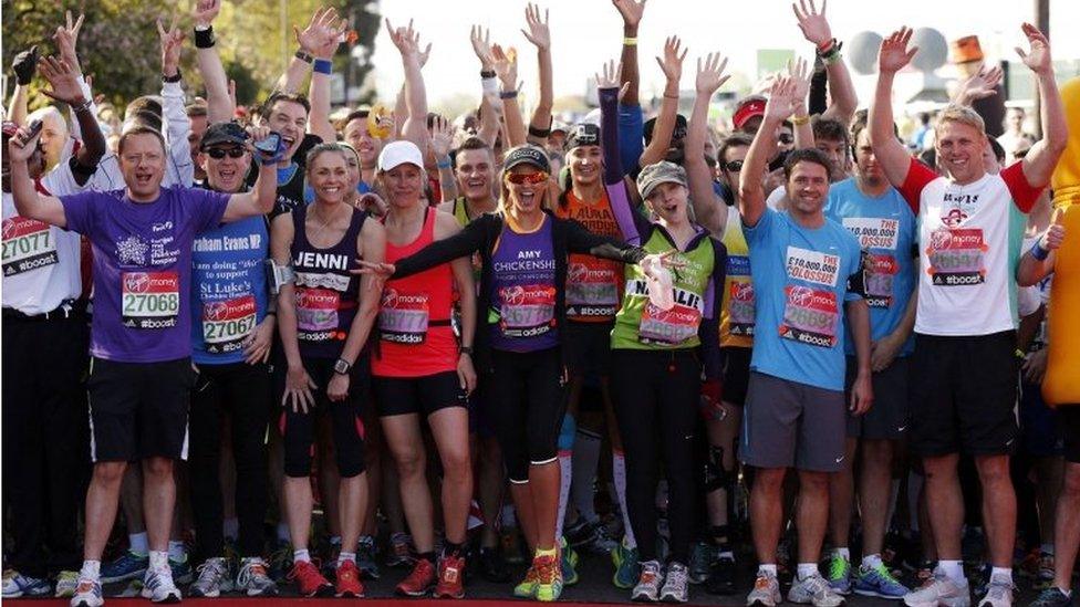 Celebrity runners gather at the start before the Virgin Money London Marathon