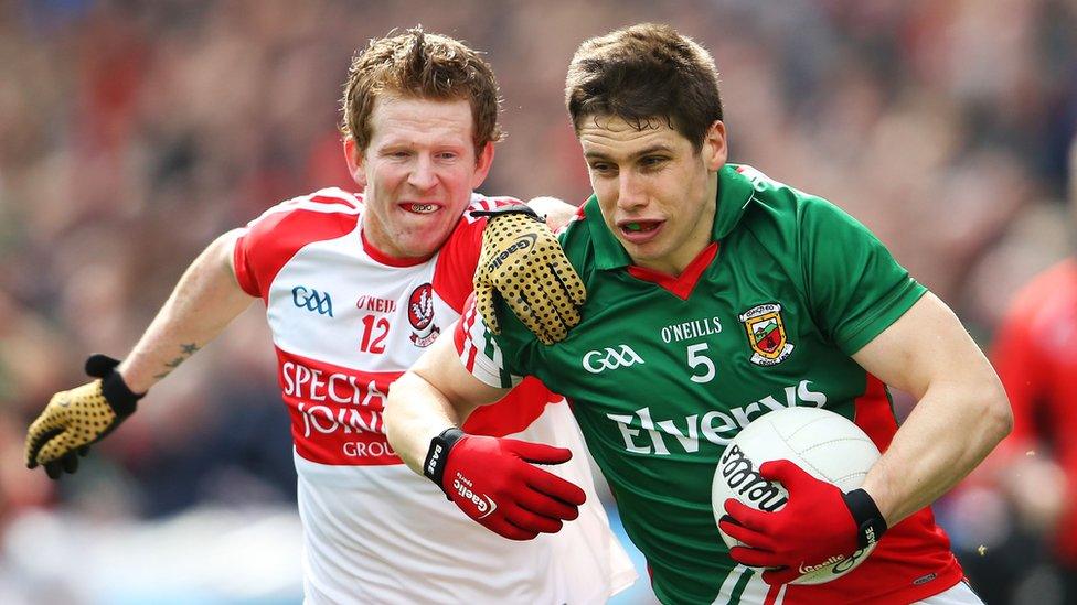 Enda Lynn attempts to dispossess Lee Keegan during the Division One semi-final at Croke Park