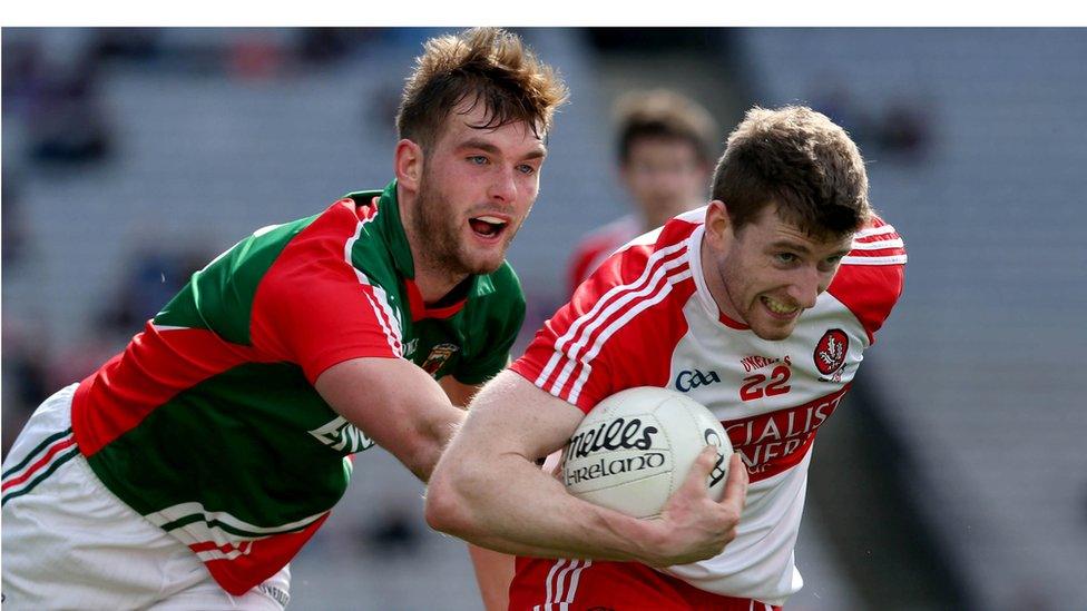 Derry's Niall Holly tries to escape the clutches of Aidan O'Shea in a keenly contested last four clash